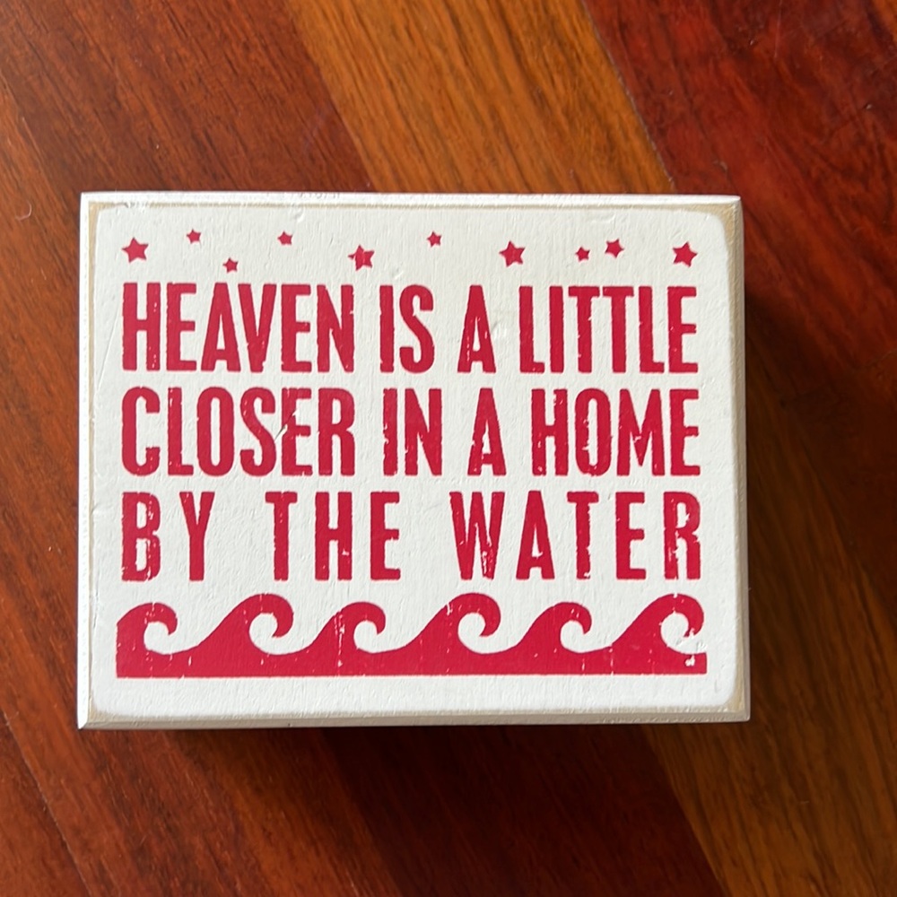 Brand new wooden sign about beach